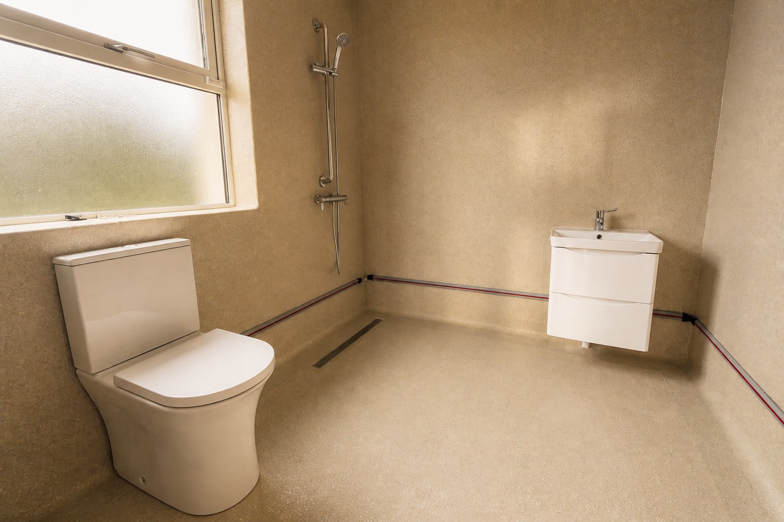En-suite wet room at Heron House with a walk-in shower, toilet, and floating vanity